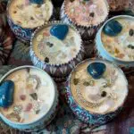 A close up of some cupcakes with jewels on them