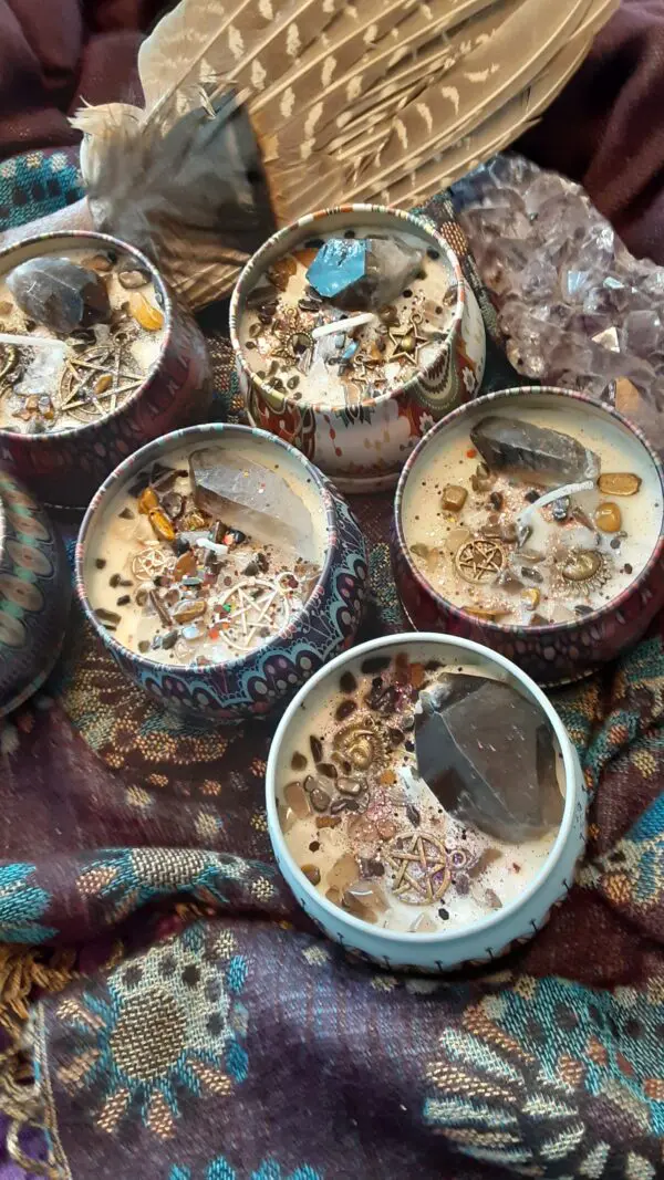 A group of candles with different types of rocks inside them.