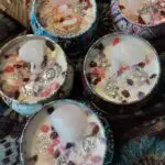A group of candles with different colored beads.